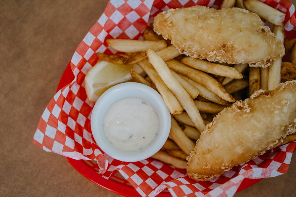 Stock photo of a fried fish basket with fries